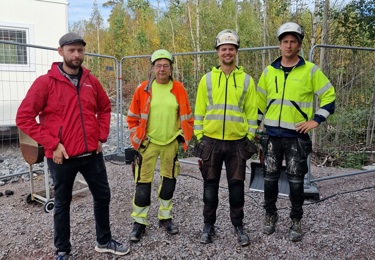 Fyra byggnadsarbetare.