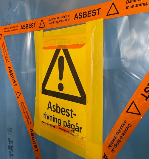 Varningsskylt om asbest